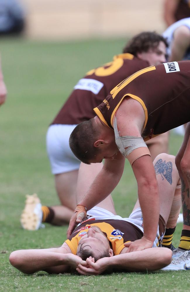 Mens senior Football BFL: Anglesea v Drysdale.Anglesea and Drysdale players react to drawn game with Drysdale 48 Matthew Piggott lying down gets helped by team mate 10 Tom Ruggles Picture: Mark Wilson