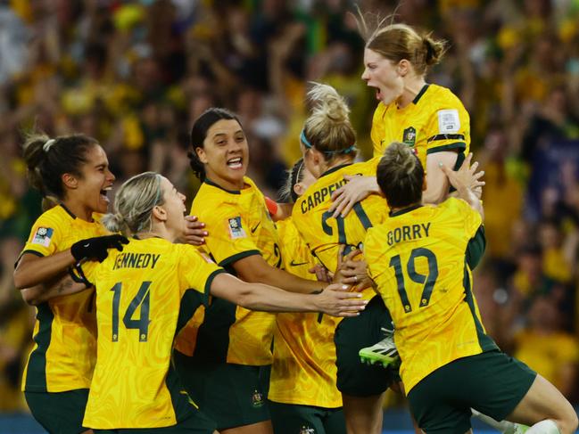 Matildas players celebrate winning the FIFA Womens World Cup Quarter final match against France in a penalty shootout at Brisbane Stadium. Picture Lachie Millard