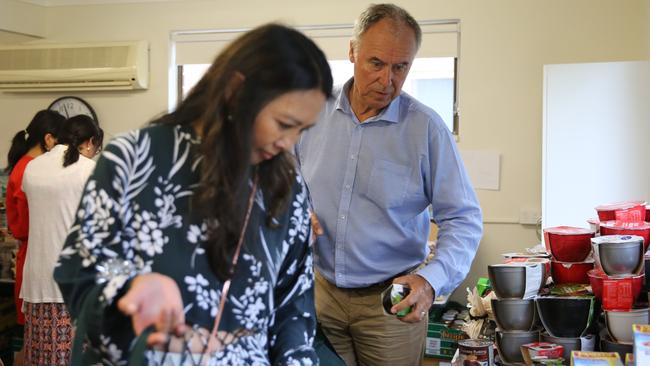 John Alexander with his partner, Deborah Chadwick, helping to pack bags of food at the North Ryde Community Centre during the Bennelong by-election in late 2017.