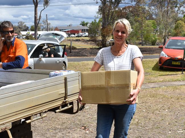 RVC Councillor Jill Lyons brings in more supplies to Rappville Showgrounds for distribution.