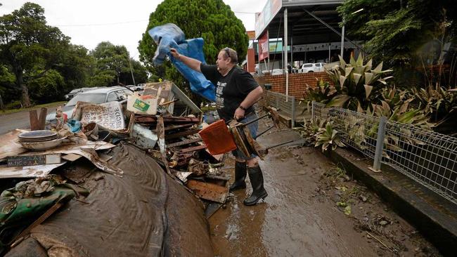 Brett Grainger, of South Lismore, helps to clean up town. Picture: Marc Stapelberg