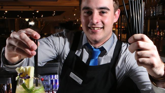 Connor Wilkinson prepares a botanical spritz cocktail with the new biodegradable straws at Bankstown Sports Club. Picture: Robert Pozo