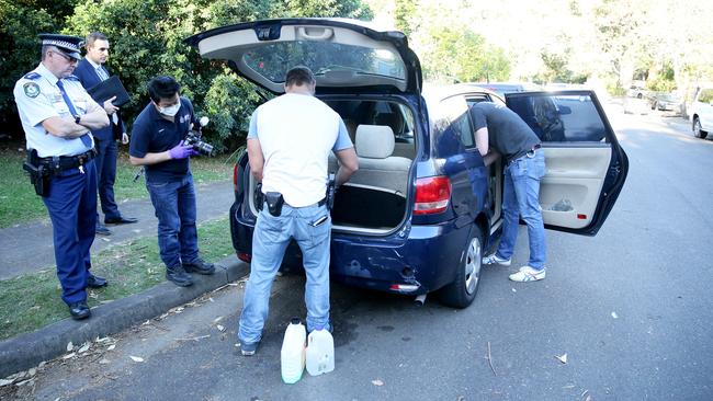 Police executing the search warrant yesterday in Macquarie Park. Picture: Justin Sanson