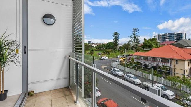 This one-bedroom unit at L2/66 Manning St, South Brisbane, is for sale for $410,000, with a call to 'submit all offers'.