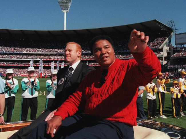 Pratt and Muhammad Ali at the 1998 AFL Grand Final. Picture: Craig Borrow