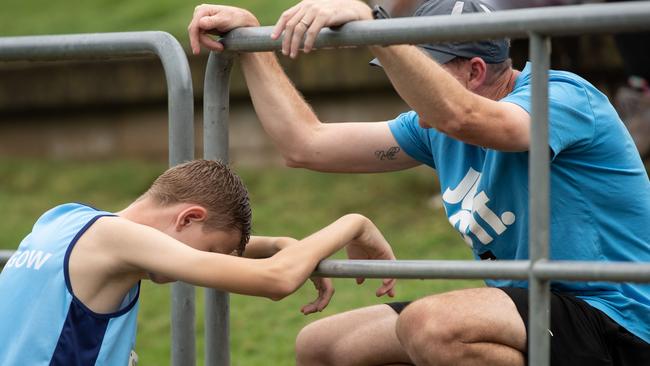 A youngster speaks to his coach after his race on the first day of three.