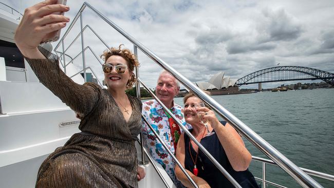 Event host Honida Beram takes a selfie with Patrea and Ed Stuttard onboard the Spirit of Migaloo during a Sydney Harbour cruise on Sunday. Picture: Bianca De Marchi