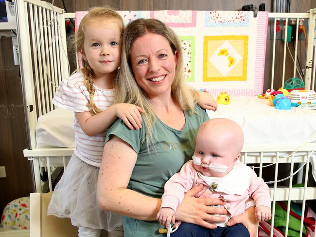 Mum of the Year nominee Christie Rea pictured at John Hunter Children's Hospital in Newcastle with her 14-month old daughter Imogen and 4-year-old daughter Catya. Christie is a mum of 5 kids whose youngest, Imogen is recovering from brain surgery after being diagnosed with a brain tumour at just two weeks old. Picture: Toby Zerna