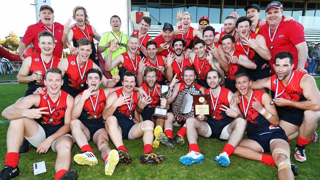 Jubilant Flagstaff Hill celebrate winning its third premiership in a row after the Southern Football League grand final, beating Reynella by 100 points. Picture: AAP/Mark Brake