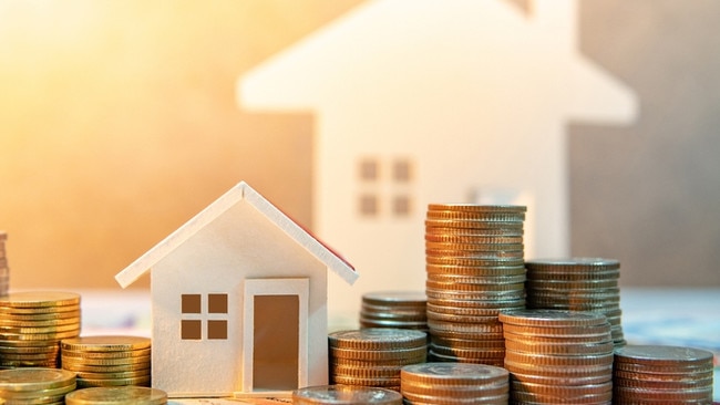 Real estate or property investment. Home mortgage loan rate. Saving money for retirement concept. Coin stack on international banknotes with house model on table. Business growth background Picture: iStock