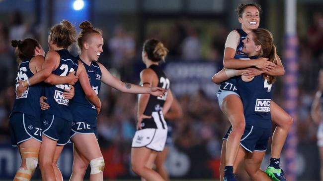 Carlton players celebrate their win over Collingwood in Round 1.