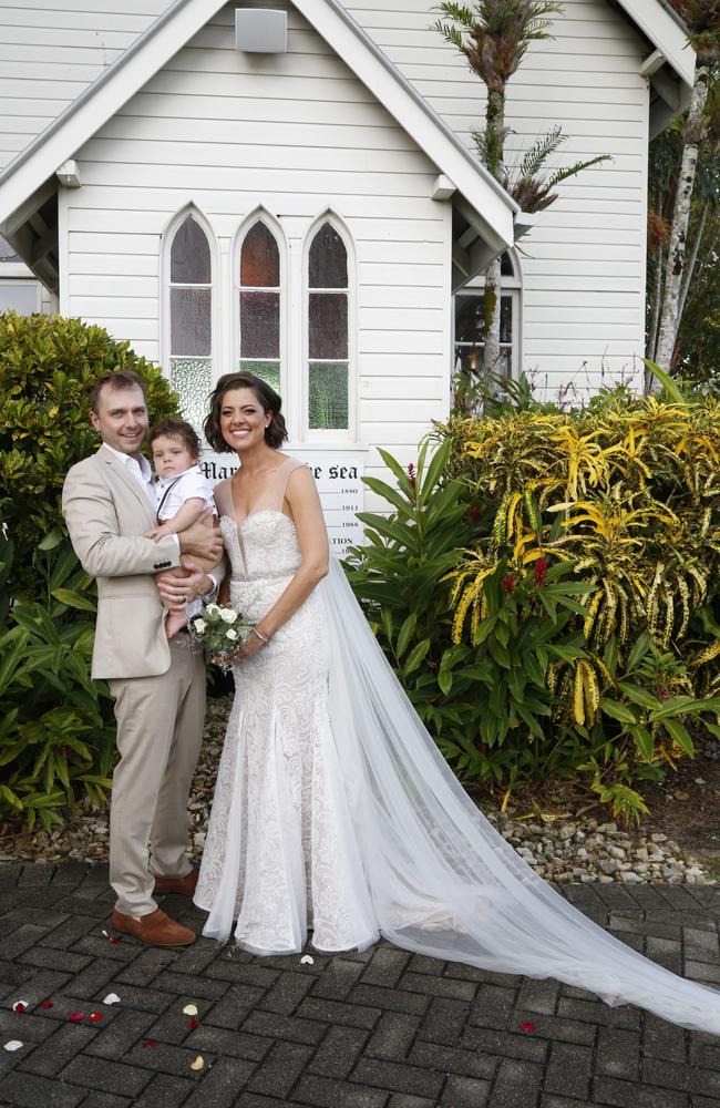 Amber Lawrence, wearing a wedding dress designed by her sister, has married Martin Newman three years after swiping right on Tinder. Picture: Jacky Cooke/Port Douglas Weddings