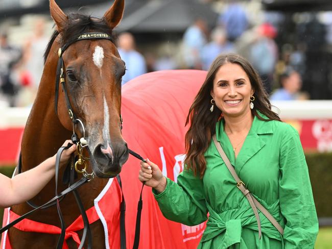 MELBOURNE, AUSTRALIA - FEBRUARY 25: Caitlin Hoysted (r) poses with Uncommon James after winning Race 9, the Ladbrokes Oakleigh Plate,  during Melbourne Racing at Sandown Lakeside on February 25, 2023 in Melbourne, Australia. (Photo by Vince Caligiuri/Getty Images)