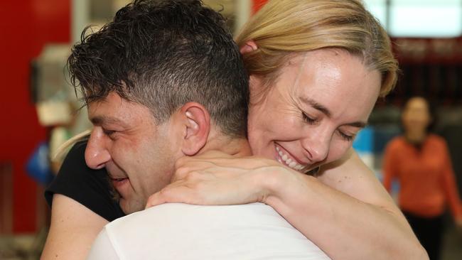 Adam de Guara embraces his partner Genevieve Wild after being apart for 5 months. Picture: NCA NewsWire / Damian Shaw