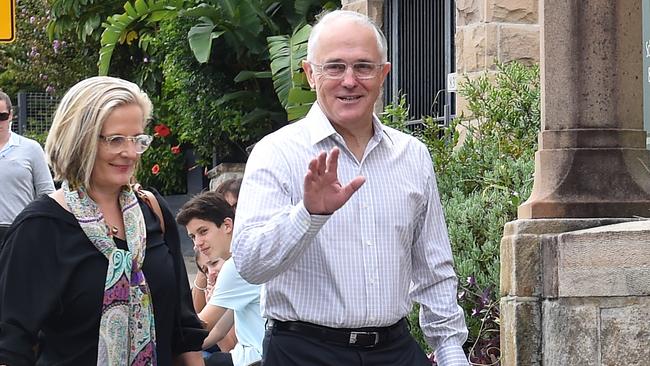 Australian Prime Minister Malcolm Turnbull (right) and his wife Lucy arrive for Easter mass in Sydney on Sunday, March 27, 2016. (AAP Image/Paul Miller) NO ARCHIVING