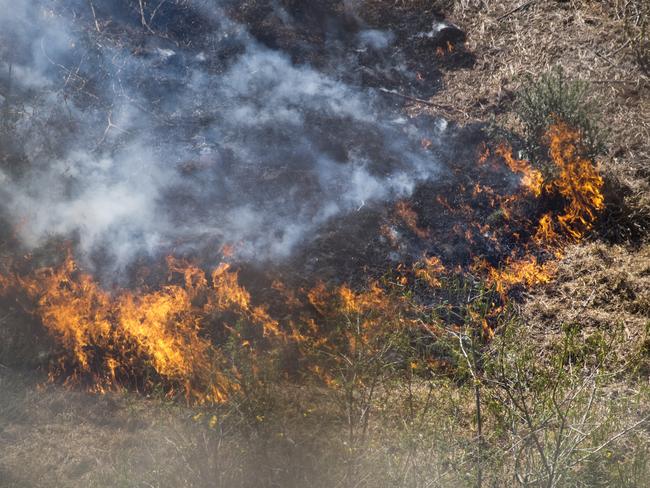 A car fire that escaped onto grassland took almost an hour to put out at Kybong yesterday afternoon. File photo.