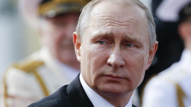 Russian President Vladimir Putin attends a military parade during a Navy Day celebration in St Petersburg. Picture: AP