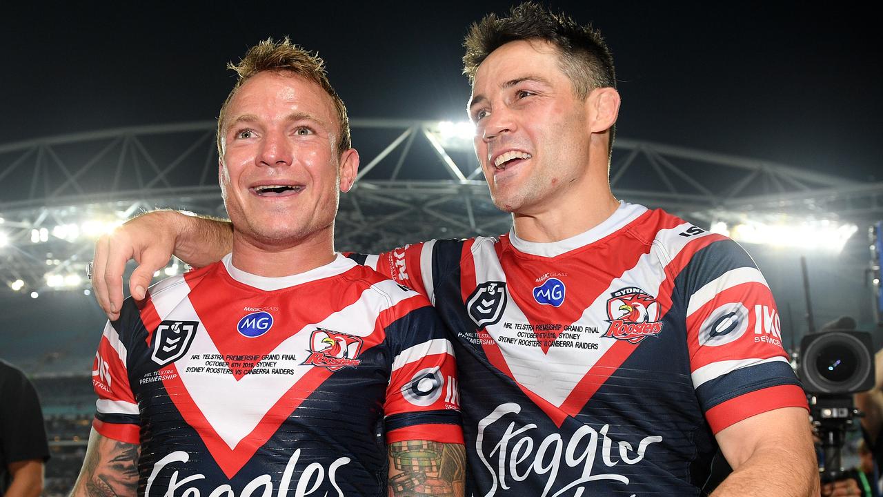 Jake Friend and Cooper Cronk of the Roosters celebrate following their win over the Raiders in the 2019 NRL Grand Final.