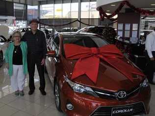 Angela and Graham Docherty were all smiles when handed the keys to their new Toyota Corolla at Toowoomba Toyota. The Cotswold Hills couple were the winners of the Grand Central Christmas Competition. Picture: Nick Houghton