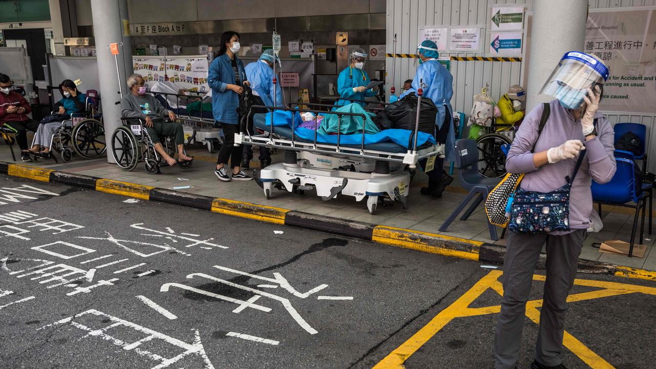 Health workers treat patients in a holding area outside Princess Margaret hospital in Hong Kong. Picture: Dale de la Rey / AFP