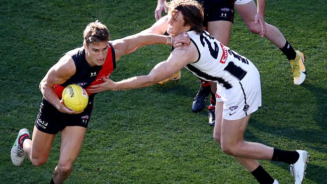 Matt Guelfi fends off Nathan Murphy of the Magpies in Round 23. Picture: Michael Klein