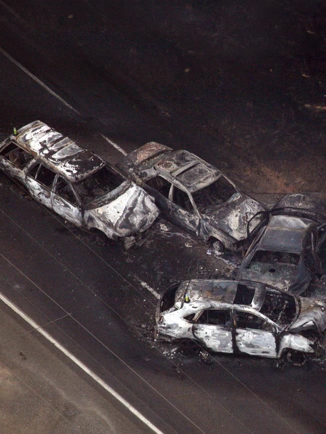 These four cars collided trying to outrun the fire at Kinglake. Picture: Mark Smith 