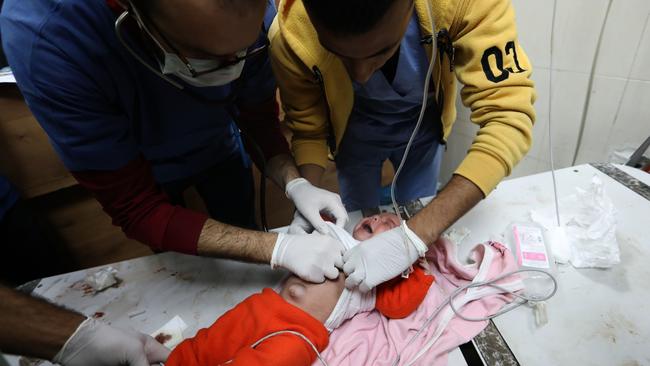 A Palestinian baby injured in Israeli air strikes is treated at Nasser Medical Hospital, one of few hospitals still functioning, on December 25. Picture: Ahmad Hasaballah/Getty Images