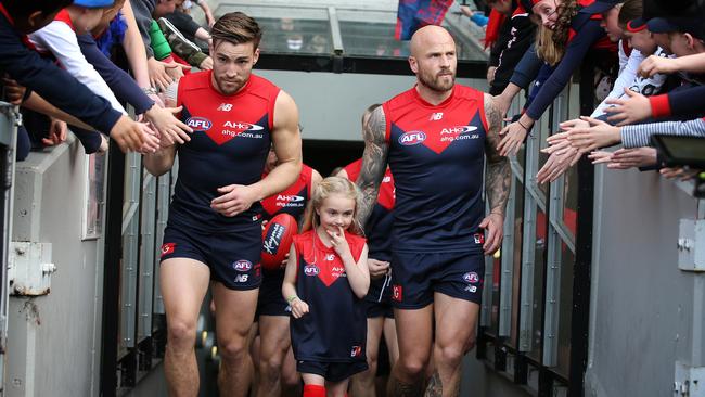 Jack Viney and Nathan Jones lead Melbourne out onto the MCG. Picture: Michael Klein