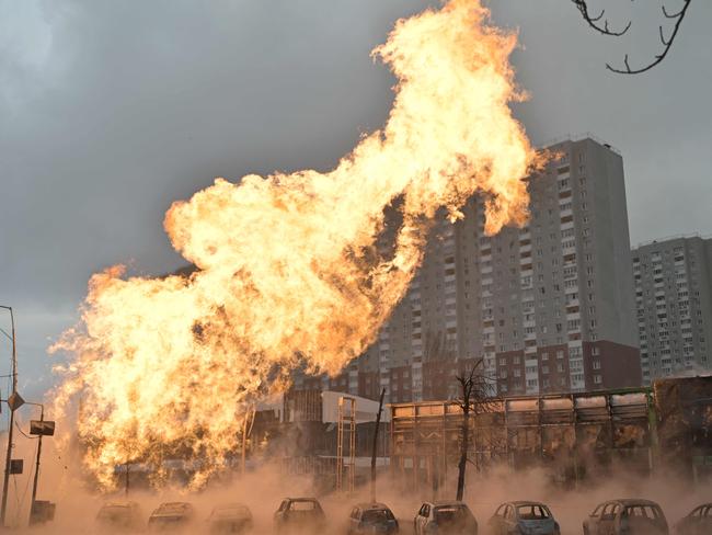 Fire and burnt-out cars are seen after a missile strike in Kyiv amid the Russian invasion of Ukraine. Pictrue: AFP