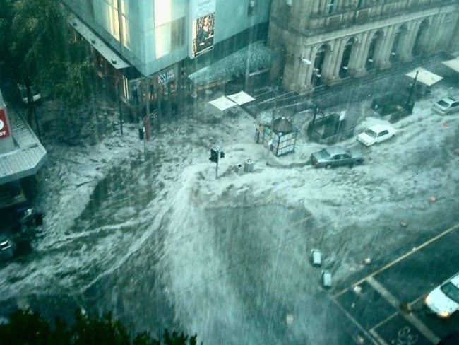 Corner of Little Bourke and Elizabeth streets inundated by floods in 2010. Picture: HWT Library.