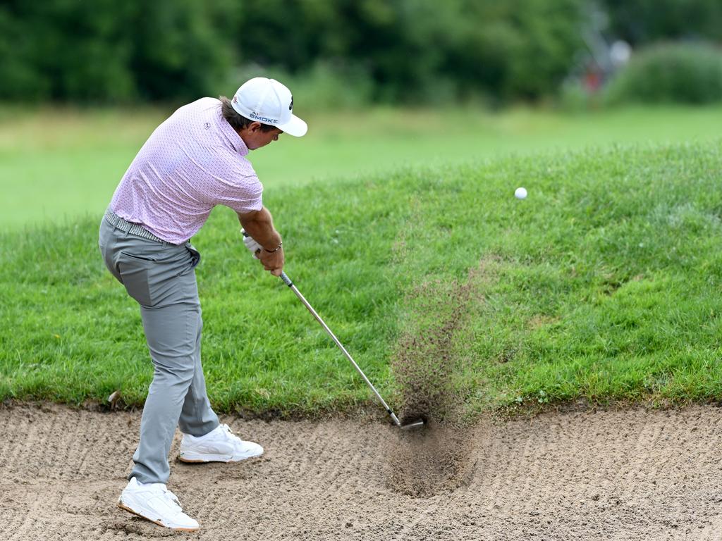 David Micheluzzi plays a ball out of a bunker during is final round of 68 at the BMW International Open. Picture: Stuart Franklin/Getty Images