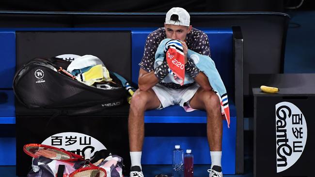 A dejected Alexei Popyrin is out of the Australian Open, going down to Russia's Daniil Medvedev. Photo: AFP.