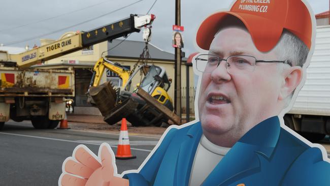 Our cardboard cutout Substitute Ian Hunter inspects the rescue efforts after an excavator fell into a hole caused by a burst water main on Prospect Road. Picture: Naomi Jellicoe