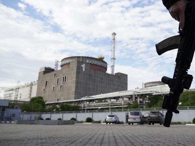 A security person standing in front of the Zaporizhzhia Nuclear Power Plant amid the ongoing Russian military action in Ukraine. Picture: AFP