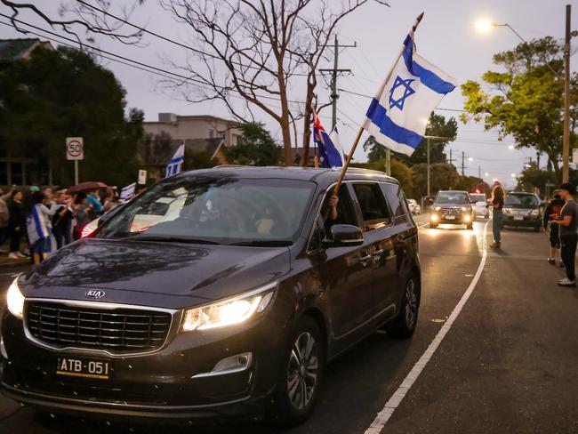 Others waved Israeli flags from their cars. Picture: Ian Currie