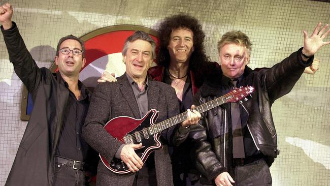 Ben Elton, actor Robert De Niro, and members of the band Queen, Brian May and Roger Taylor at the Dominion in 2002 to launch the musical 'We Will Rock You'.