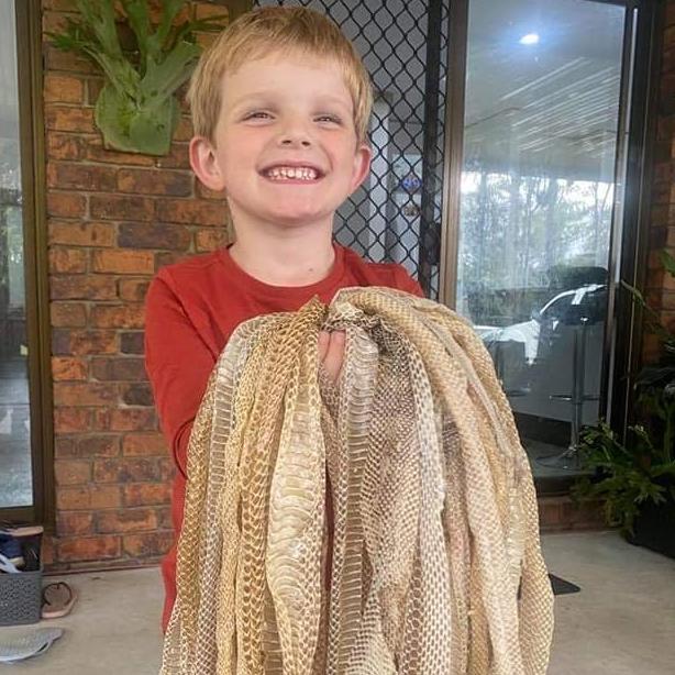 One of the kids with the skins. Picture: Sunshine Coast Snake Catchers