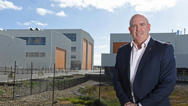 ASC Shipbuilding managing director Craig Lockhart in front of the block consolidation and ship assembly hall (rear). Picture: Tom Huntley