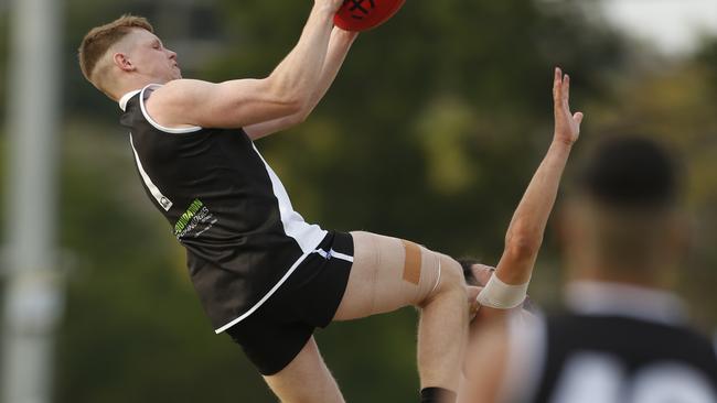 Nathan Peddle takes a speccie for Oakleigh District against Highett. Picture: Valeriu Campan