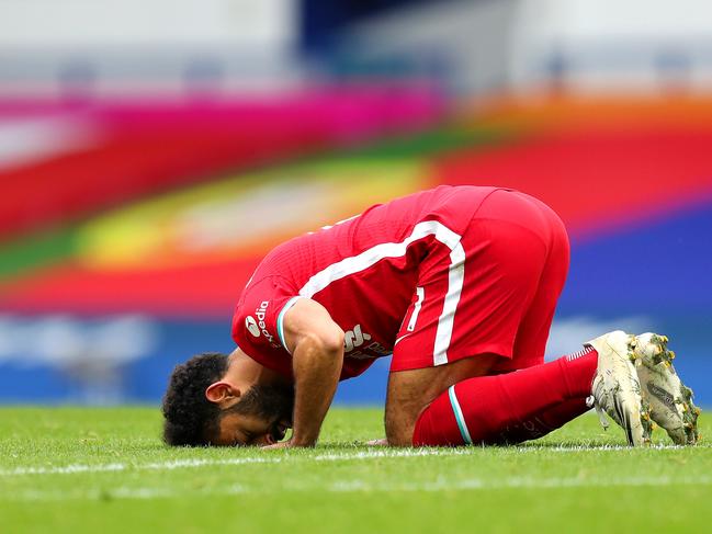 LIVERPOOL, ENGLAND - OCTOBER 17: Mohamed Salah of Liverpool celebrates after scoring his team's second goal during the Premier League match between Everton and Liverpool at Goodison Park on October 17, 2020 in Liverpool, England. Sporting stadiums around the UK remain under strict restrictions due to the Coronavirus Pandemic as Government social distancing laws prohibit fans inside venues resulting in games being played behind closed doors. (Photo by Catherine Ivill/Getty Images)