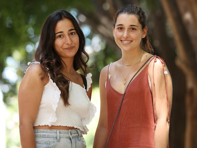 Beatriz Perez and Ana Leyun, both 24, Milton, have both had their vaccinations. Picture: Liam Kidston