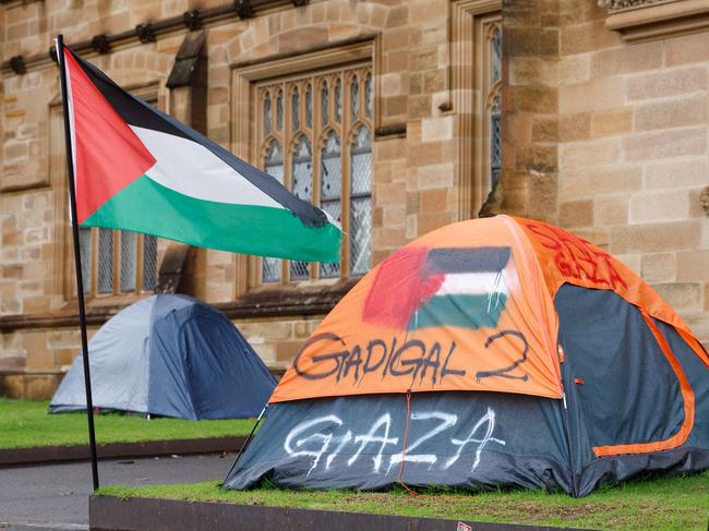 SYDNEY, AUSTRALIA - NewsWire Photos JUNE 15 2024. Scenes of pro-gaza & Palestine tent camp on the lawn of Sydney University. The uni has ordered the pro-Palestinian encampment to pack up and leave campus eight weeks after the tent protest appeared on its lawns. Picture: NewsWire / Max Mason-Hubers