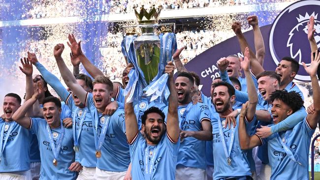 Manchester City players celebrate winning the title in 2023. Picture: Oli Scarff/AFP