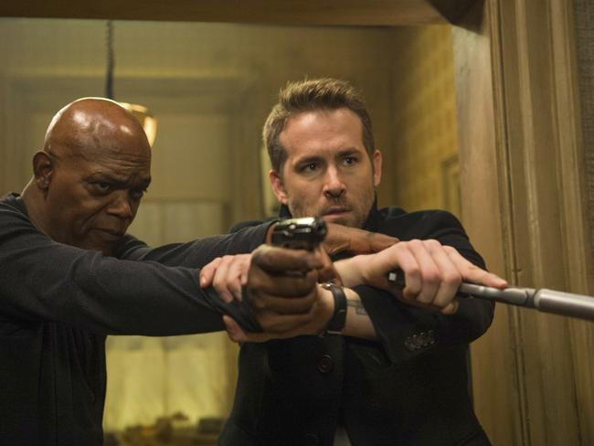 This image released by Lionsgate shows Samuel L. Jackson, left, and Ryan Reynolds in "The Hitman's Bodyguard." (Jack English/Lionsgate via AP)