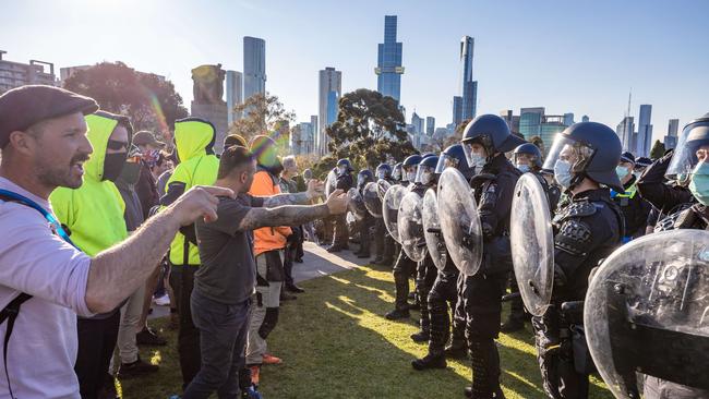 Protesters and police during last week’s demonstrations in Melbourne. Picture: Jason Edwards