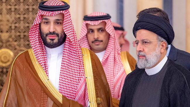 Saudi Crown Prince Mohammed bin Salman, left, with Iran's late president Ebrahim Raisi. Picture: AFP