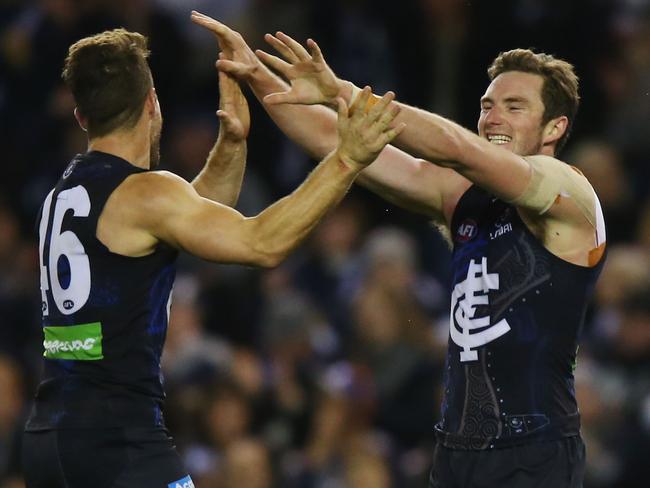 Jed Lamb celebrates a goal with Matthew Wright.