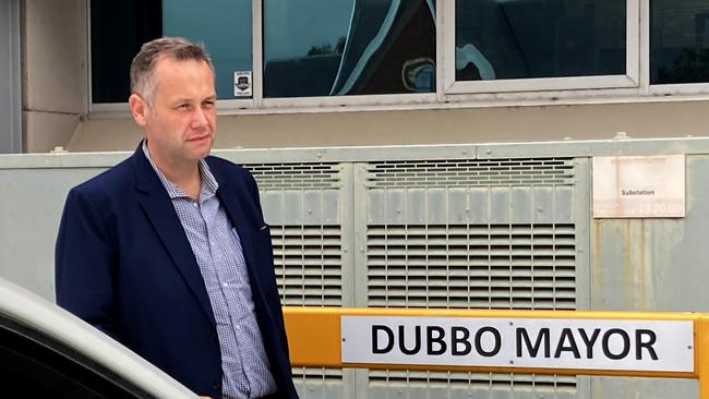 Dubbo mayor Ben Shields leaves council chambers after first day back at work.