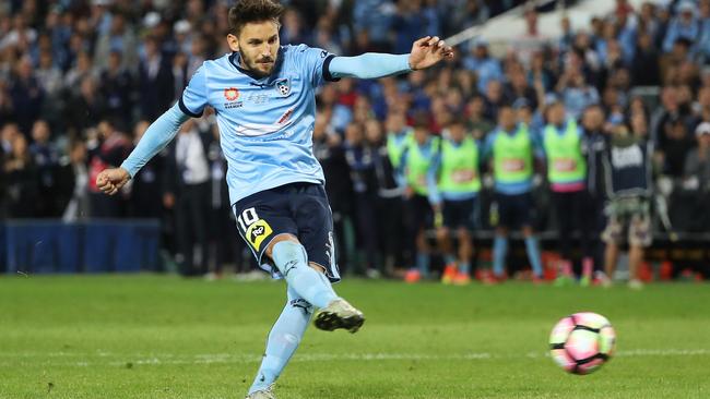 Ninkovic scores the winning penalty for the Sky Blues. Photo: Brett Costello