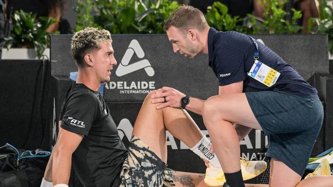 Thanasi Kokkinakis called a medical time-out three games in. Picture: AFP